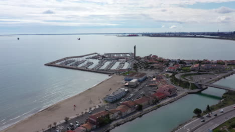 Fos-sur-mer-marina-with-oil-refinery-in-background-aerial-shot-France